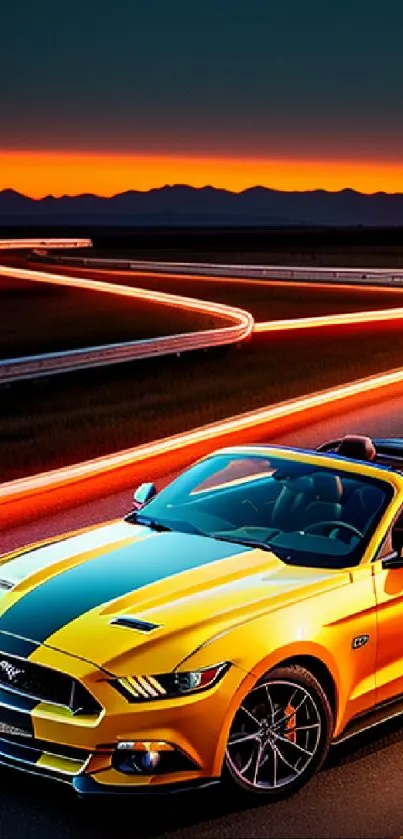 Yellow sports car on winding road at sunset backdrop.