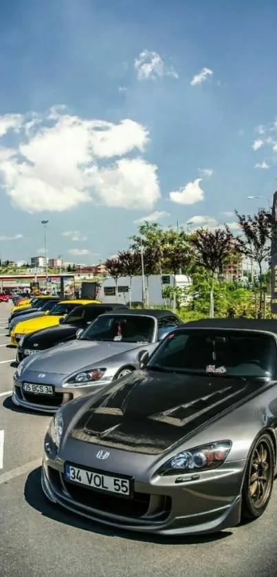 Lineup of sleek sports cars under a blue sky.