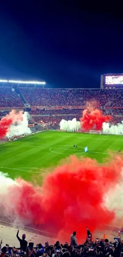 Vibrant soccer stadium with red and white smoke and lively fans at night.