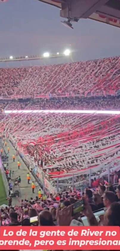 Energetic crowd in a football stadium with banners and cheering fans at a live match.