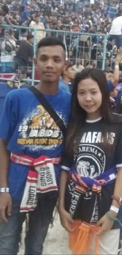 Fans at a crowded stadium event, showcasing team colors.