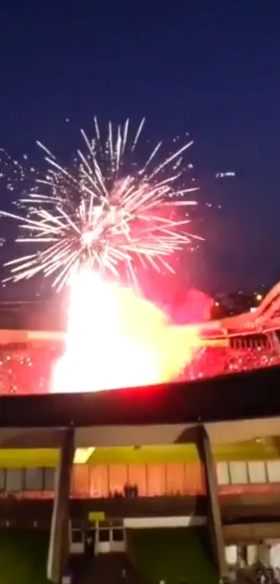 Spectacular fireworks lighting up a stadium at night, casting vibrant colors.