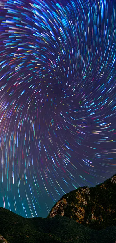 Mesmerizing star trails in night sky wallpaper with vibrant colors.