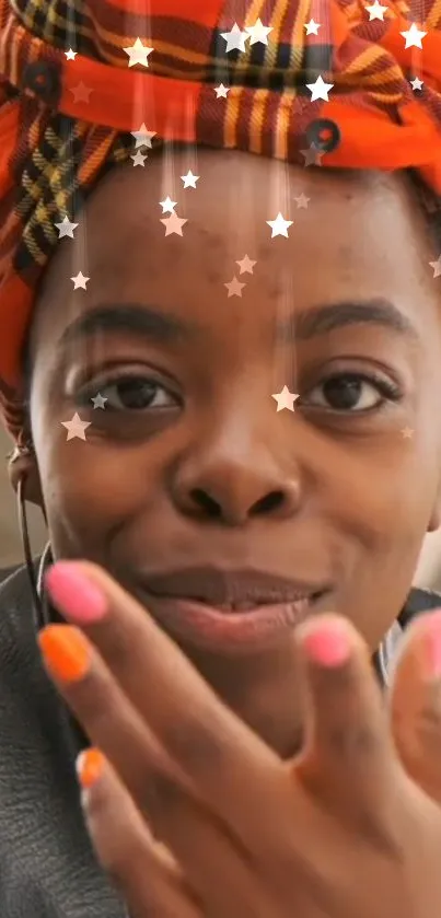 Woman with orange plaid headwrap and colorful nails under floating stars.