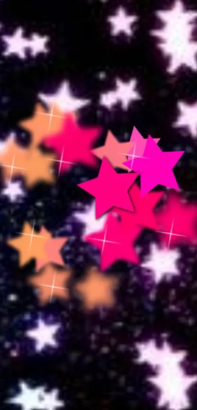 Colorful stars wallpaper with pink and orange stars on a dark background.