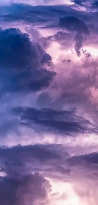 Mobile wallpaper with vibrant purple and blue storm clouds.