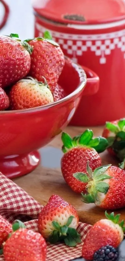 Fresh strawberries in a red bowl, perfect for a vibrant phone wallpaper.