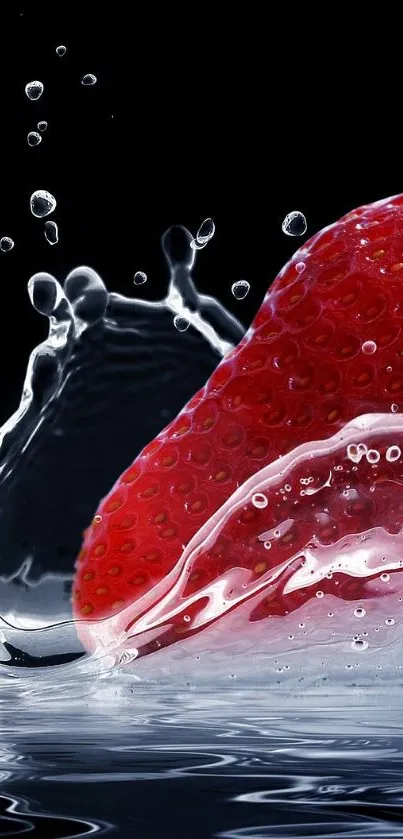 Red strawberry splashing into water with a dark background.