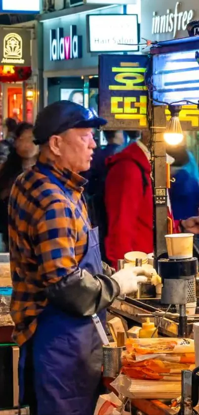 Korean street vendor serving food at bustling night market.