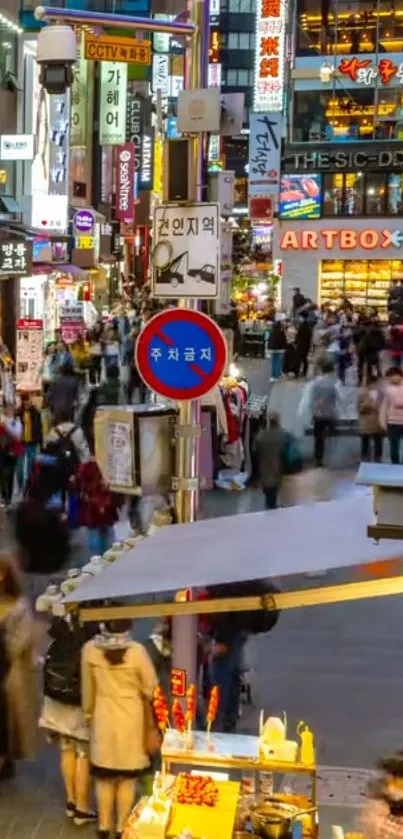 Vibrant city street scene with neon signs and bustling crowd.