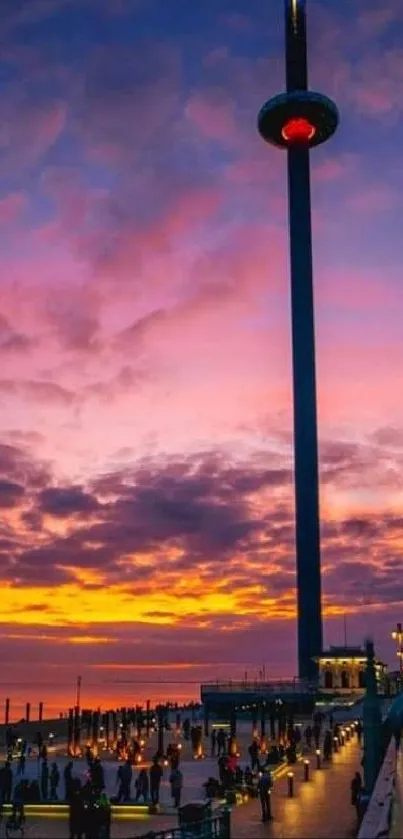 Cityscape silhouetted against a vibrant purple sunset sky.