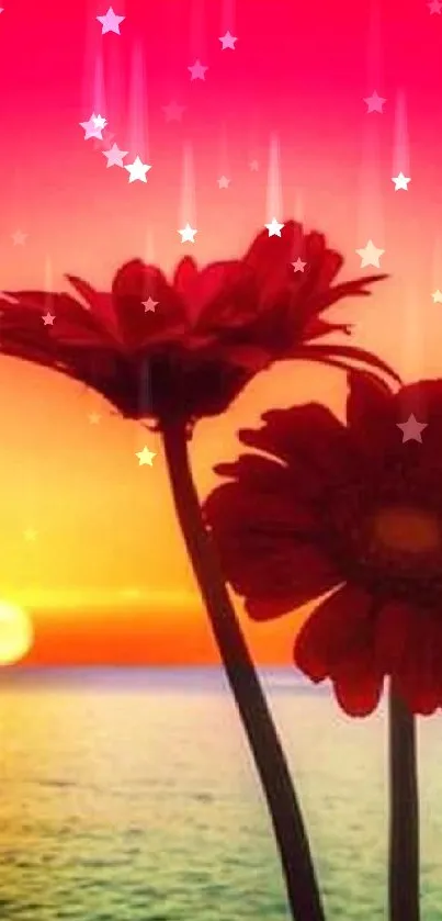 Two flowers silhouetted against a vibrant red sunset over the ocean.