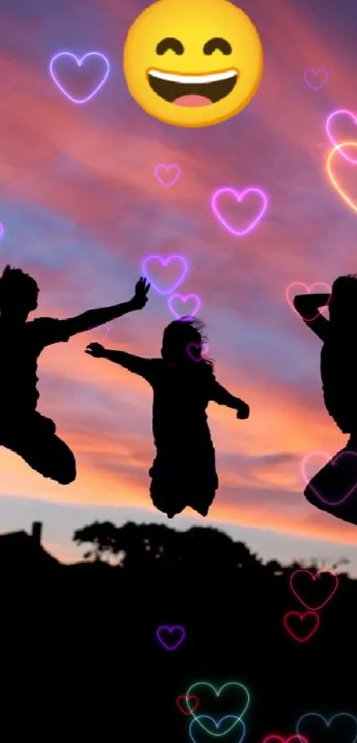 Silhouette figures jumping against a vibrant sunset sky, with a smiling emoji overhead.