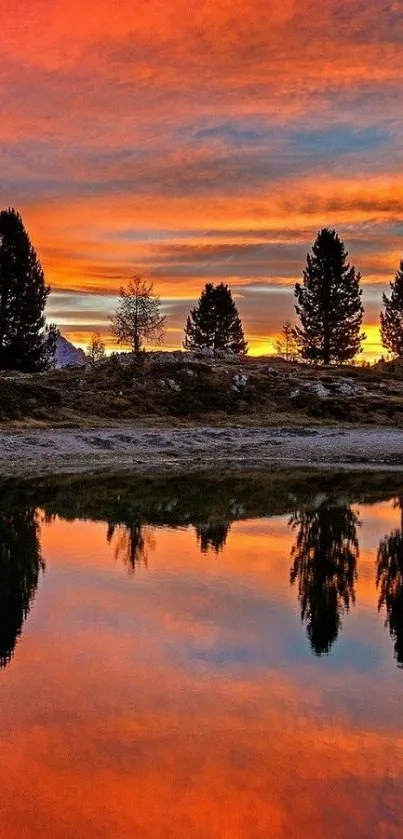 Vibrant sunset reflecting on a calm lake surrounded by trees.