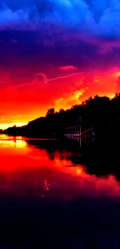 Vivid sunset with lightning over reflected water.