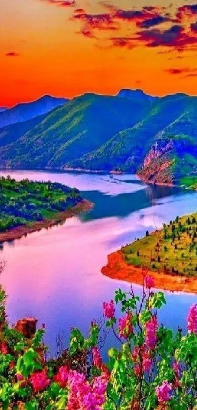 Vibrant sunset over mountains with colorful sky and river view.