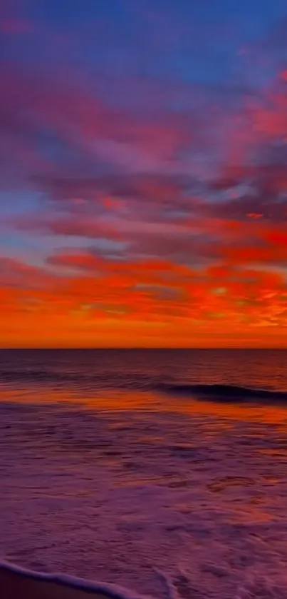 Stunning sunset over the ocean with orange and pink hues.