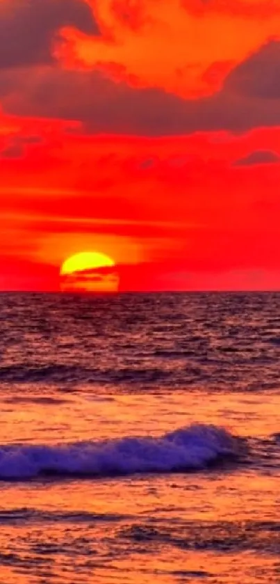 Crimson sunset over a tranquil ocean horizon.