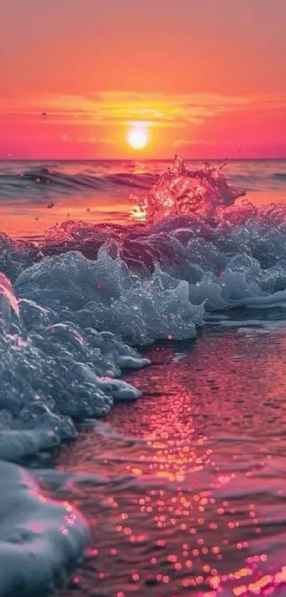 Vibrant pink and orange sunset over ocean waves on a serene evening.