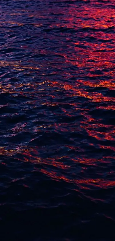 Deep purple ocean waves with vibrant sunset hues in a mobile wallpaper.