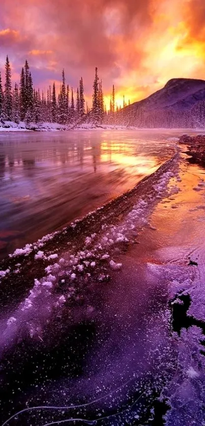 Vibrant sunset over a snowy frozen river with mountains and trees.