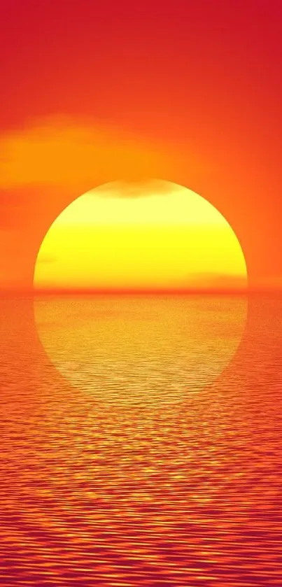 Vibrant sunset over a calm ocean with red and yellow hues.