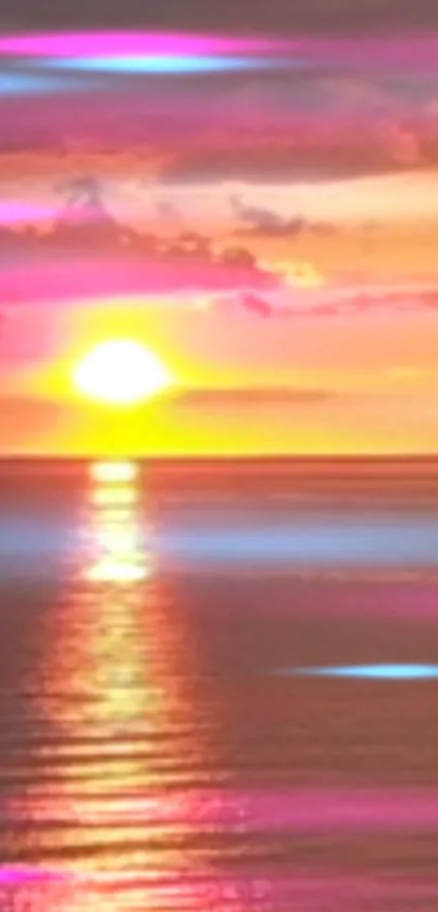 Vibrant sunset over calm ocean with pink and purple hues.