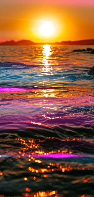 Vibrant sunset over ocean with colorful reflections.