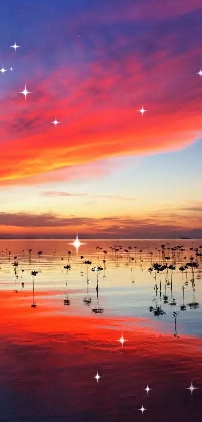 Vibrant sunset reflecting on a calm lake with red and blue hues.