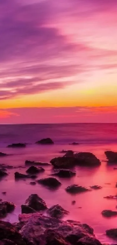 Vibrant sunset seascape with colorful skies and rocky shoreline.