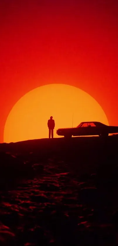 Silhouette of person against vibrant sunset with car on hill.