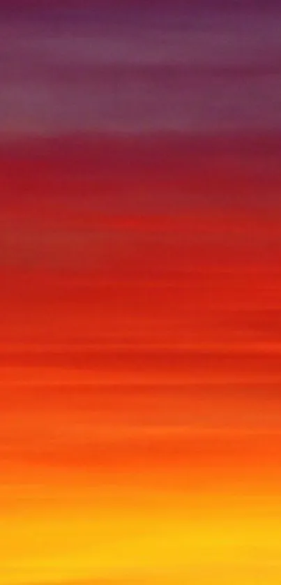 Vibrant sunset sky with orange, purple, and yellow hues.