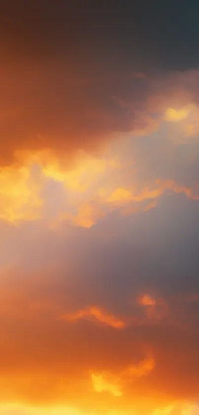 Vibrant orange and yellow sunset sky with clouds.