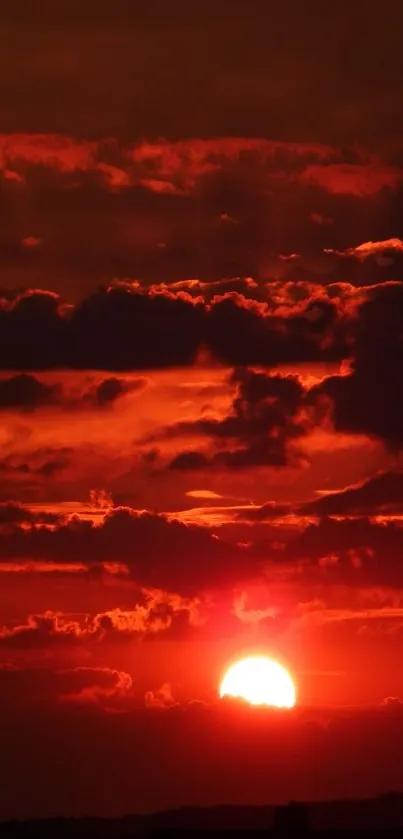 Vibrant sunset sky with dramatic clouds over a glowing horizon.