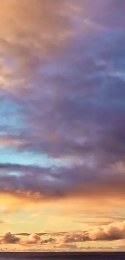 Vibrant sky during sunset with orange and purple clouds.