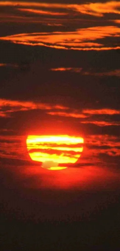 Vibrant orange sunset with clouds forming beautiful patterns.