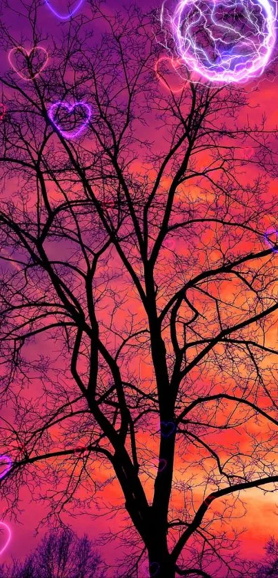 Silhouette of a tree against a vibrant purple and orange sunset.
