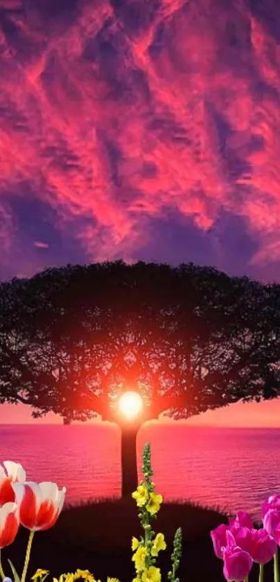 Majestic tree at sunset with colorful flowers and sky.