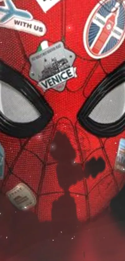 Red superhero mask with stickers for a dynamic mobile wallpaper.