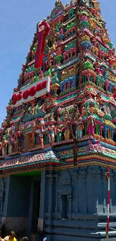 Colorful temple facade under clear blue sky.