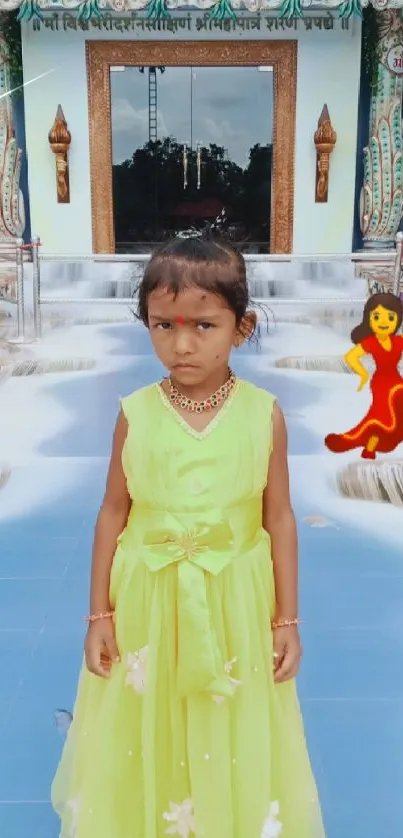 Child in a bright dress with temple background.