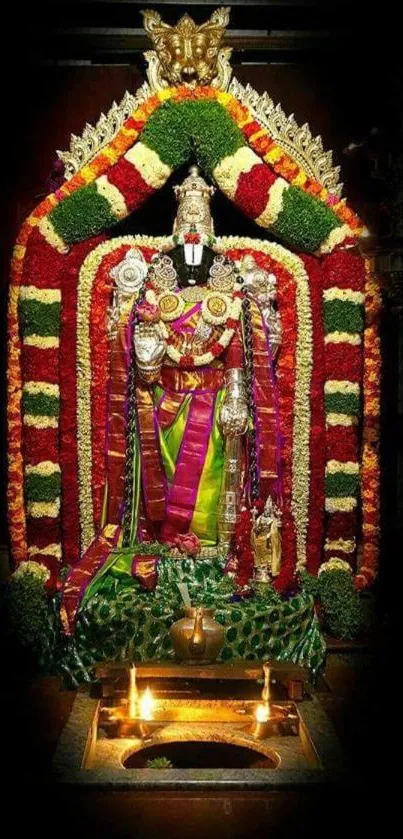 Vibrant temple deity with floral decorations.