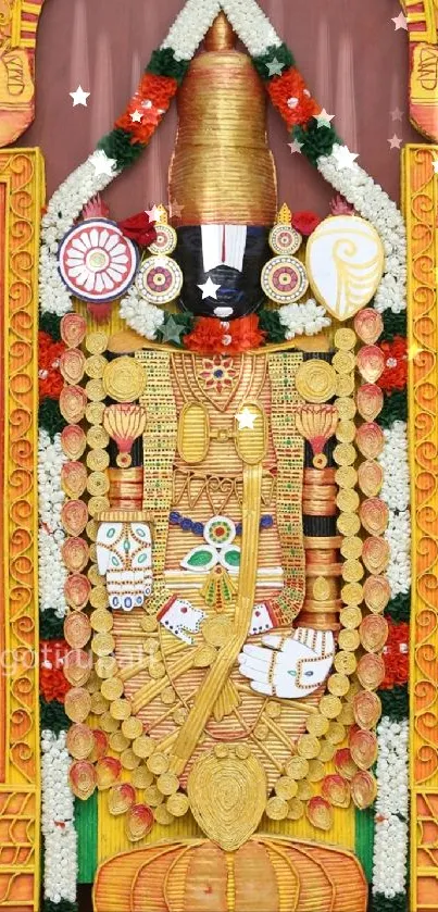 Hindu temple deity adorned with gold and colorful garlands.