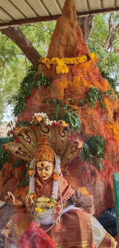 Vibrant temple shrine with deity statue and decorations.