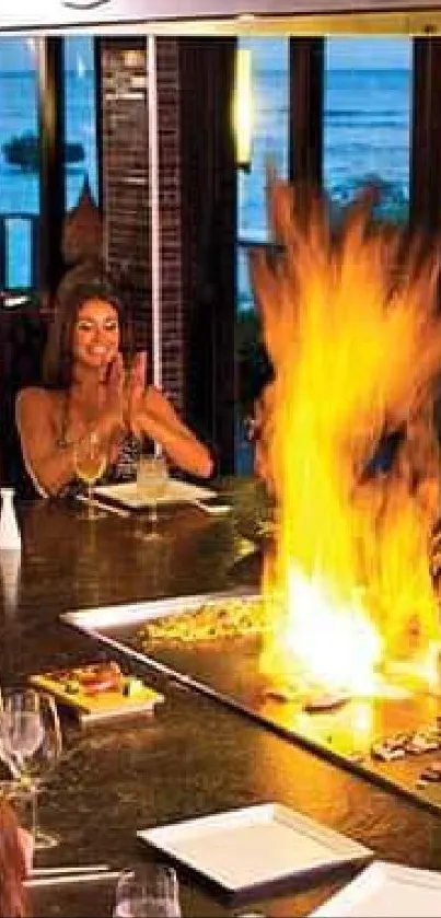 Teppanyaki chef cooks with flames while guests watch.