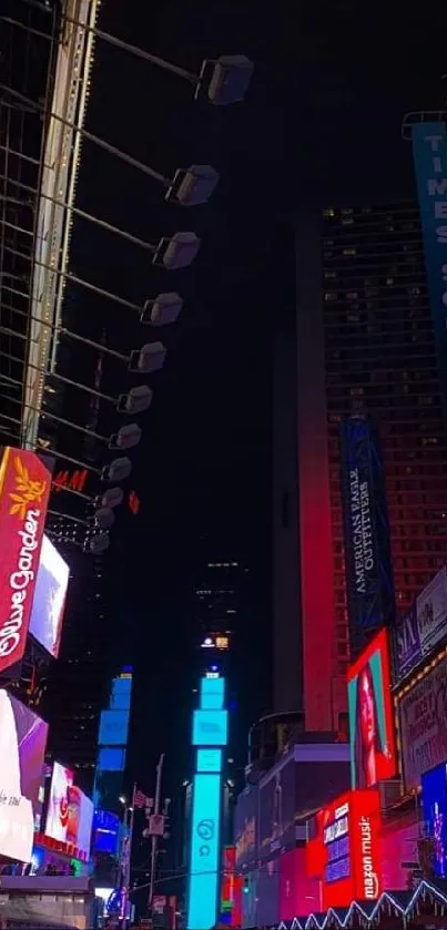 Times Square glowing with vibrant billboards at night.