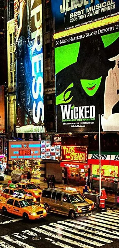 Times Square at night with bright billboards and taxis on the street.