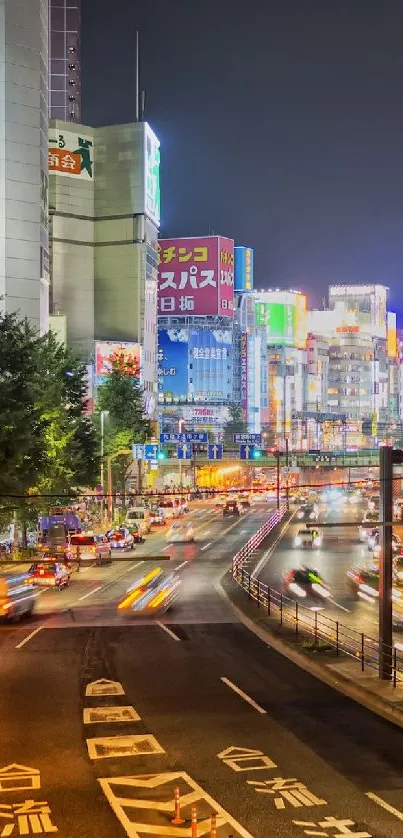 Tokyo cityscape at night with vibrant lights and busy streets.