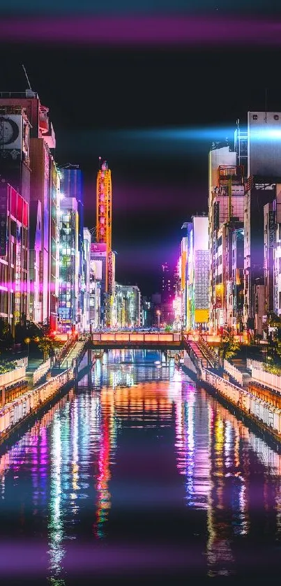 Vibrant Tokyo canal with colorful city lights reflecting in the water at night.