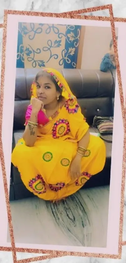 Vibrant traditional attire with yellow dress and artistic design on marble background.